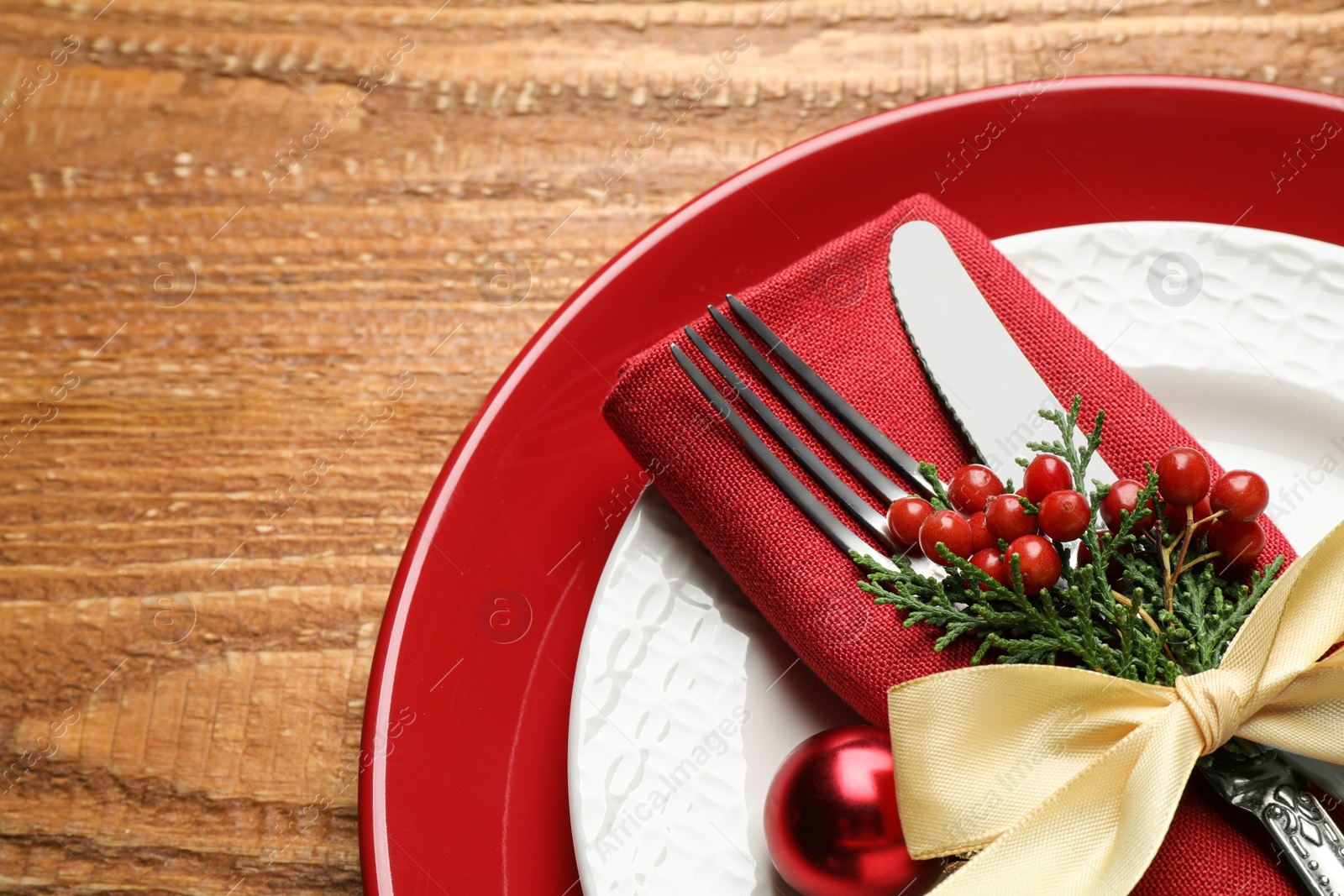 Photo of Beautiful Christmas table setting on wooden background, top view