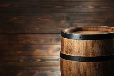 One wooden barrel near wall, closeup. Space for text