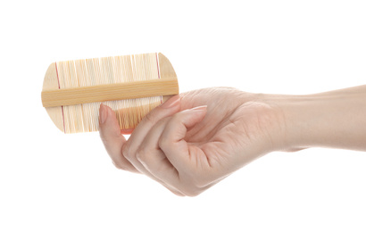 Photo of Woman holding wooden beard comb on white background, closeup