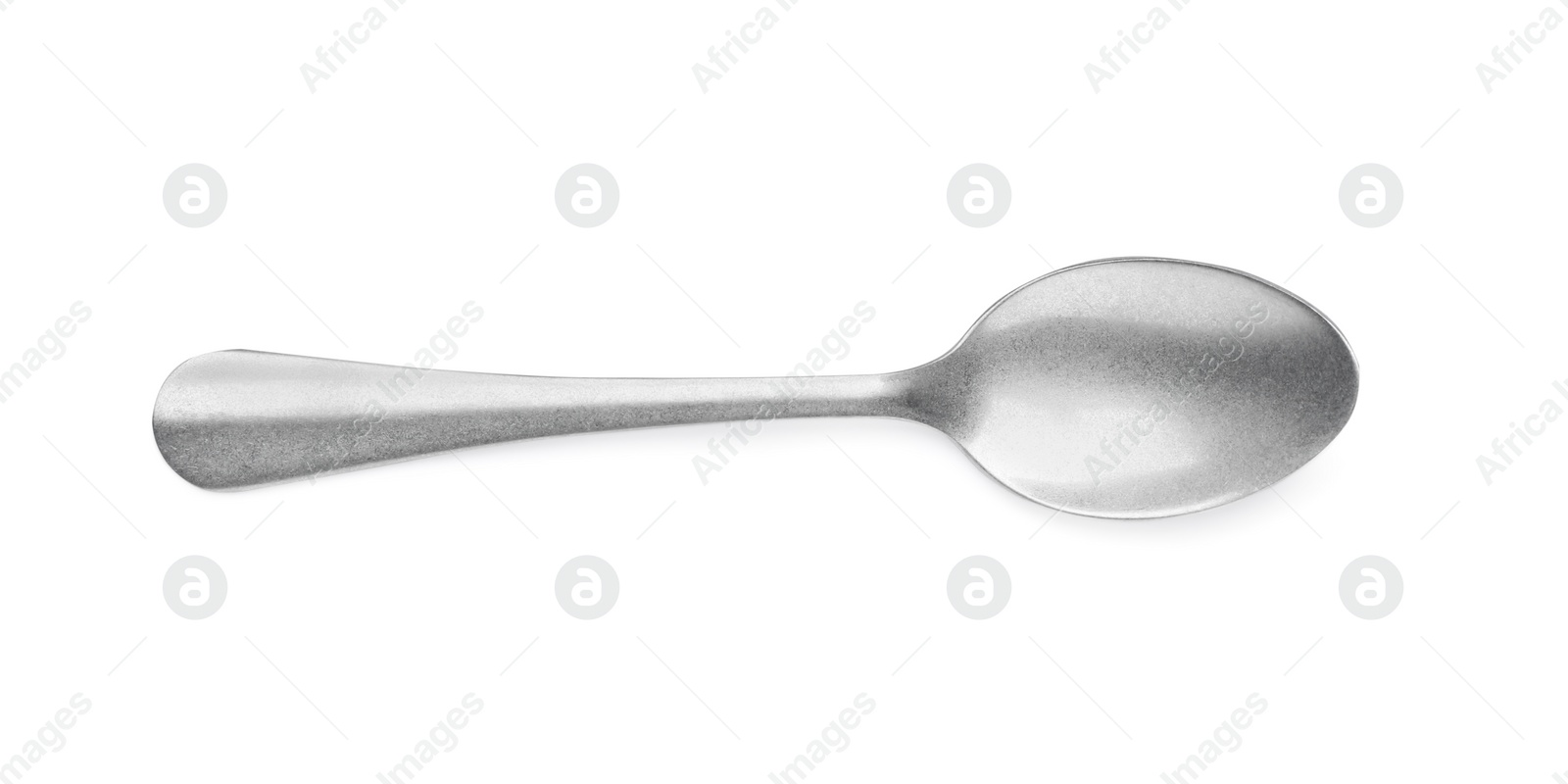 Photo of New clean shiny spoon isolated on white, top view