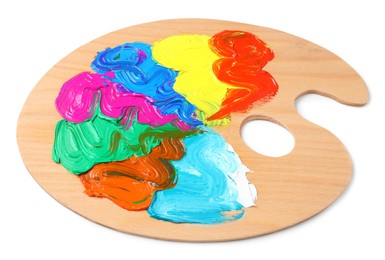 Photo of Palette with paints on white background. Artist equipment