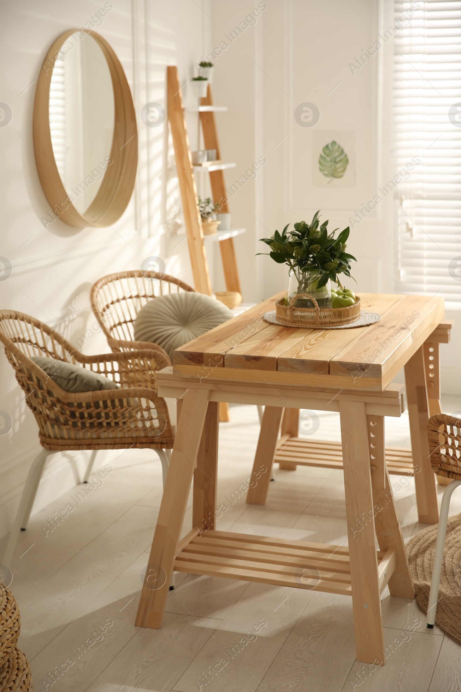 Photo of Stylish wooden dining table and chairs in room. Interior design