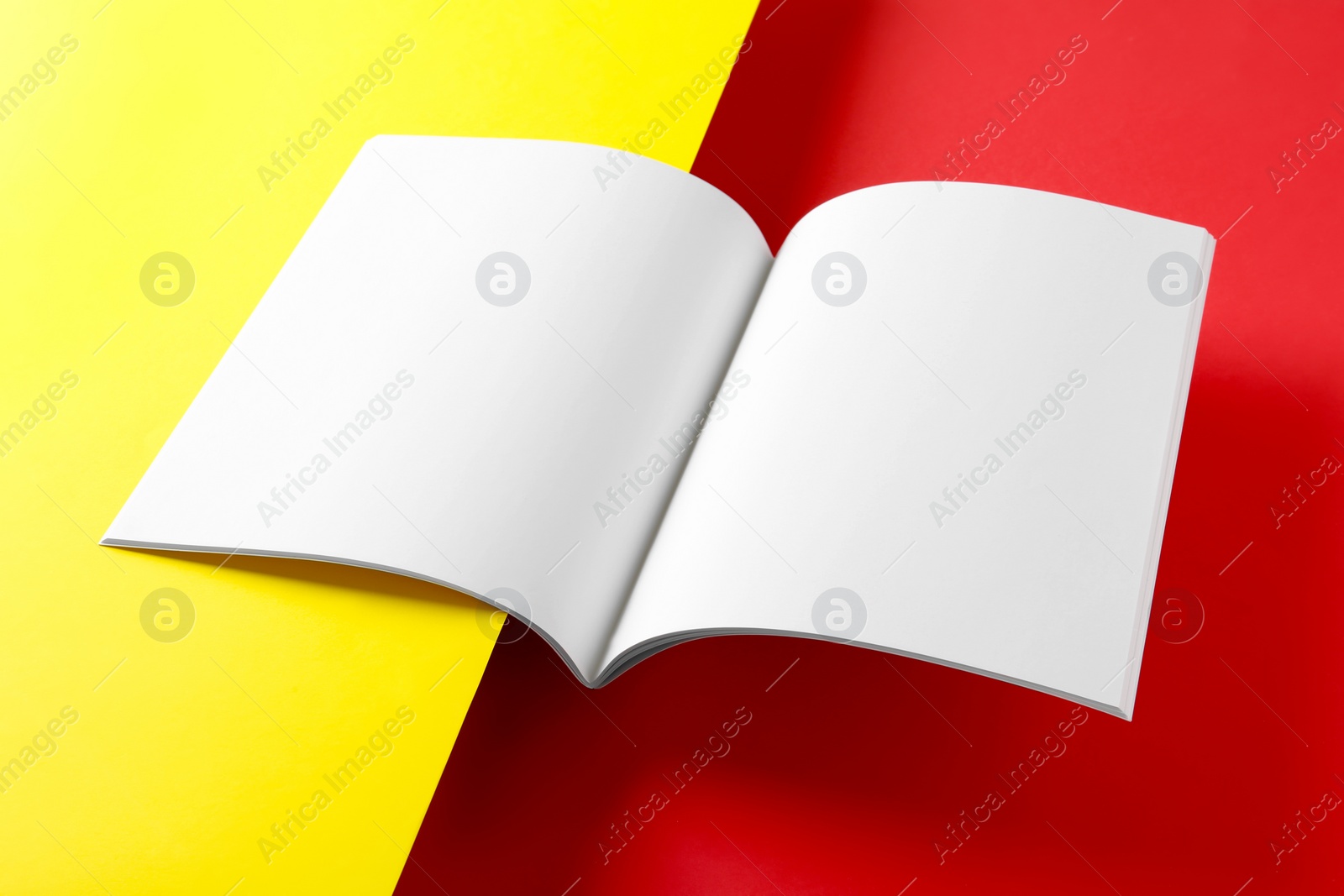 Photo of Empty book pages on color background. Mockup for design