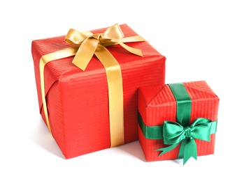 Photo of Beautifully wrapped gift boxes on white background