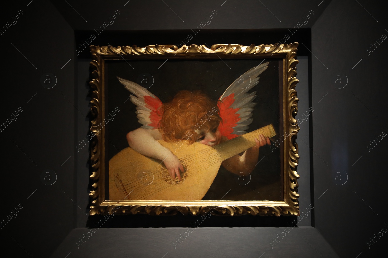 Photo of Florence, Italy - February 8, 2024: Famous painting "Angel Musician" by Rosso Fiorentino at Uffizi gallery