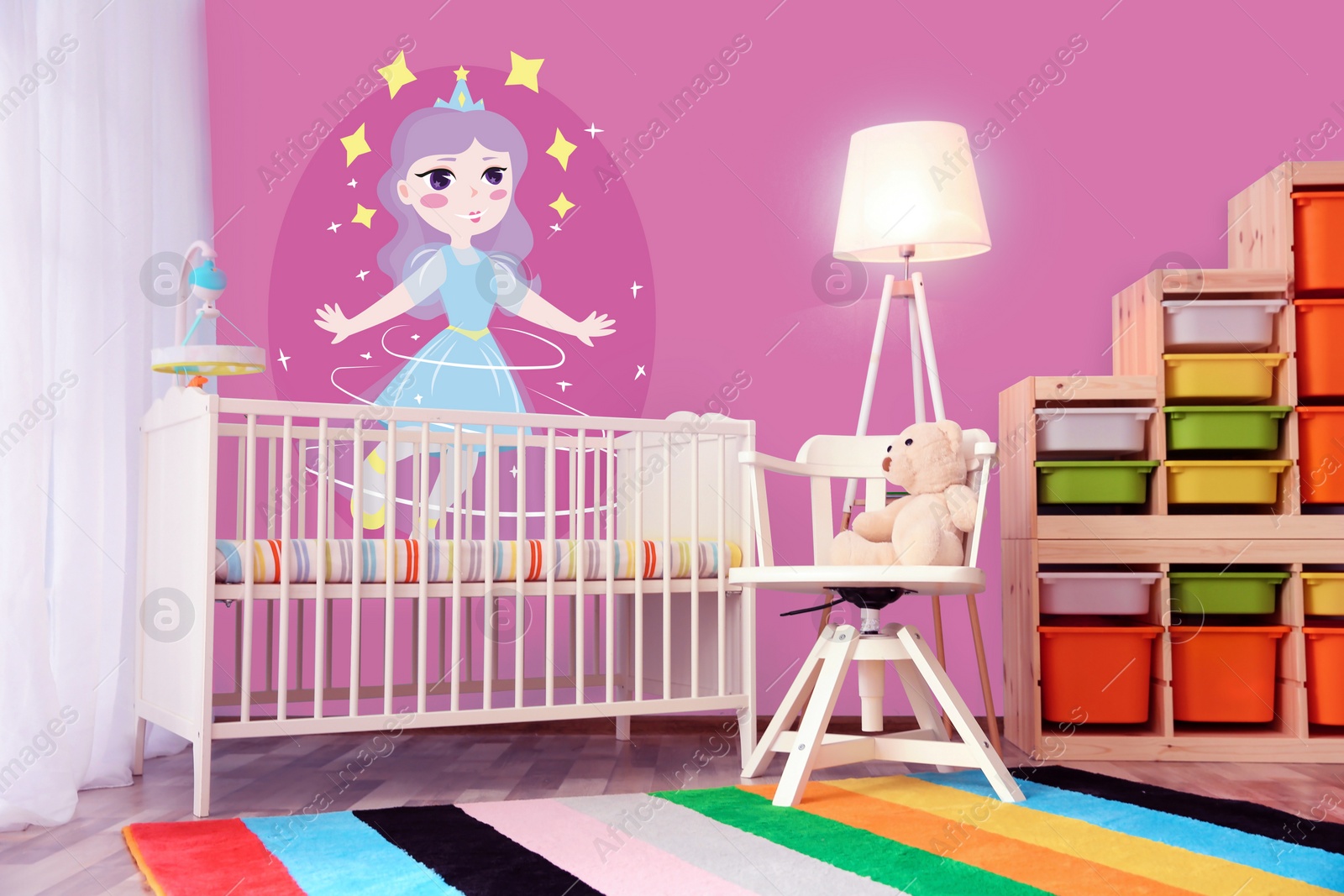Image of Baby room interior with crib near window. Pink wallpapers with princess