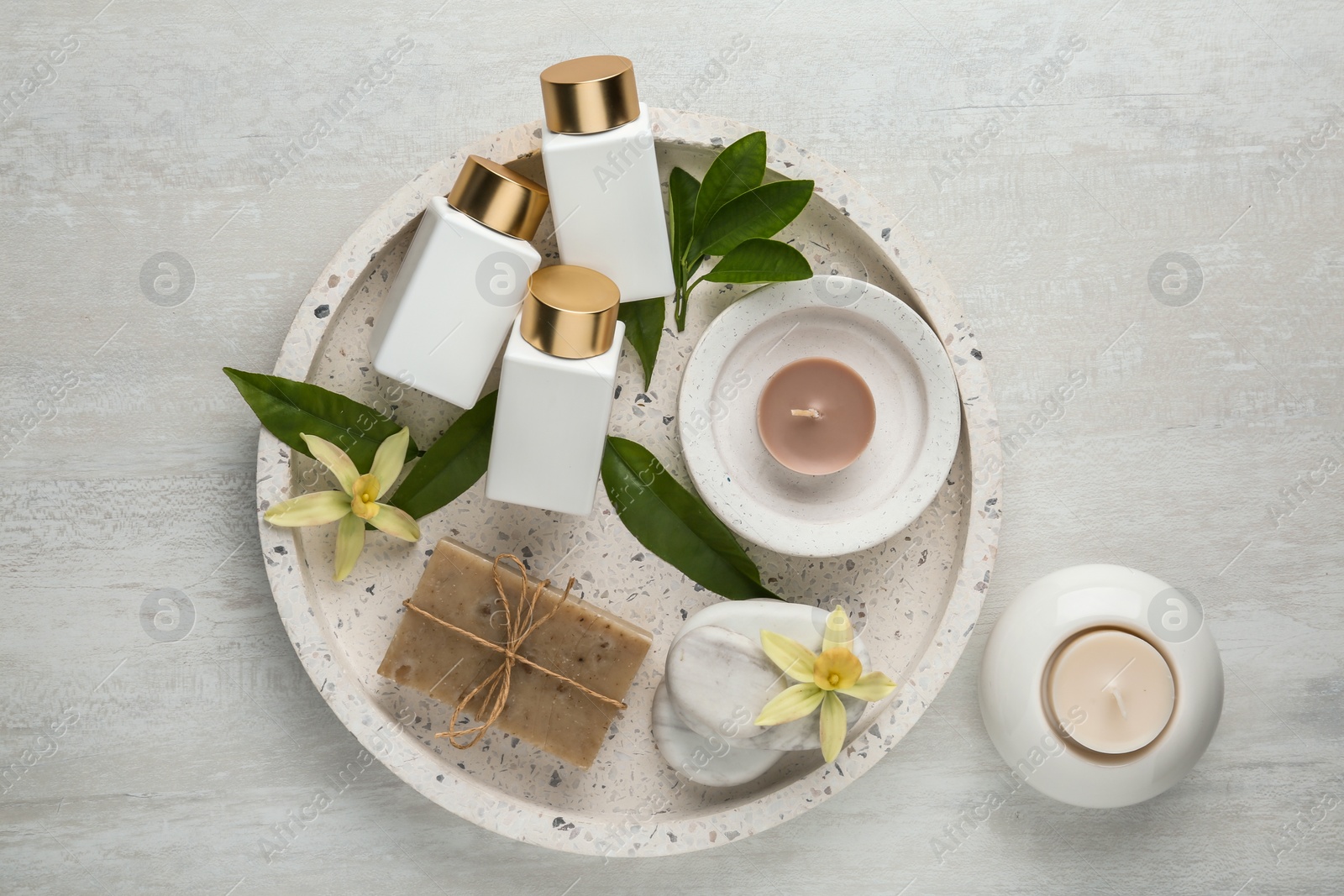 Photo of Flat lay composition with spa supplies on wooden table