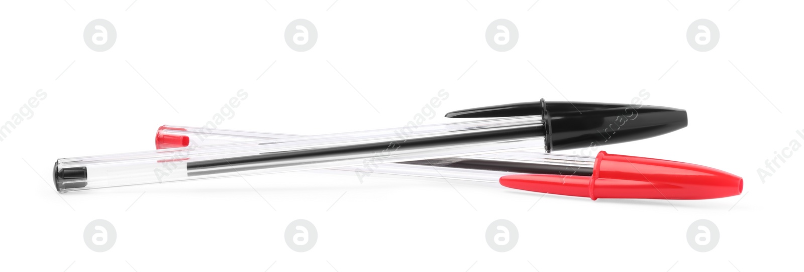 Photo of New black and red plastic pens isolated on white