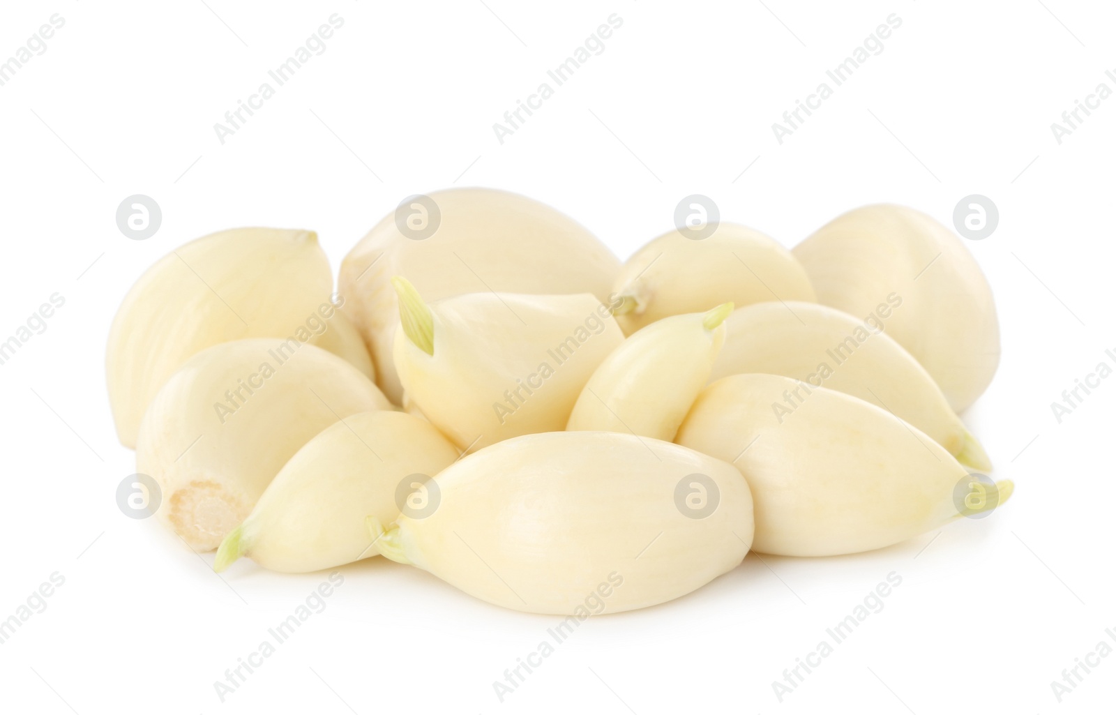 Photo of Peeled cloves of fresh garlic isolated on white