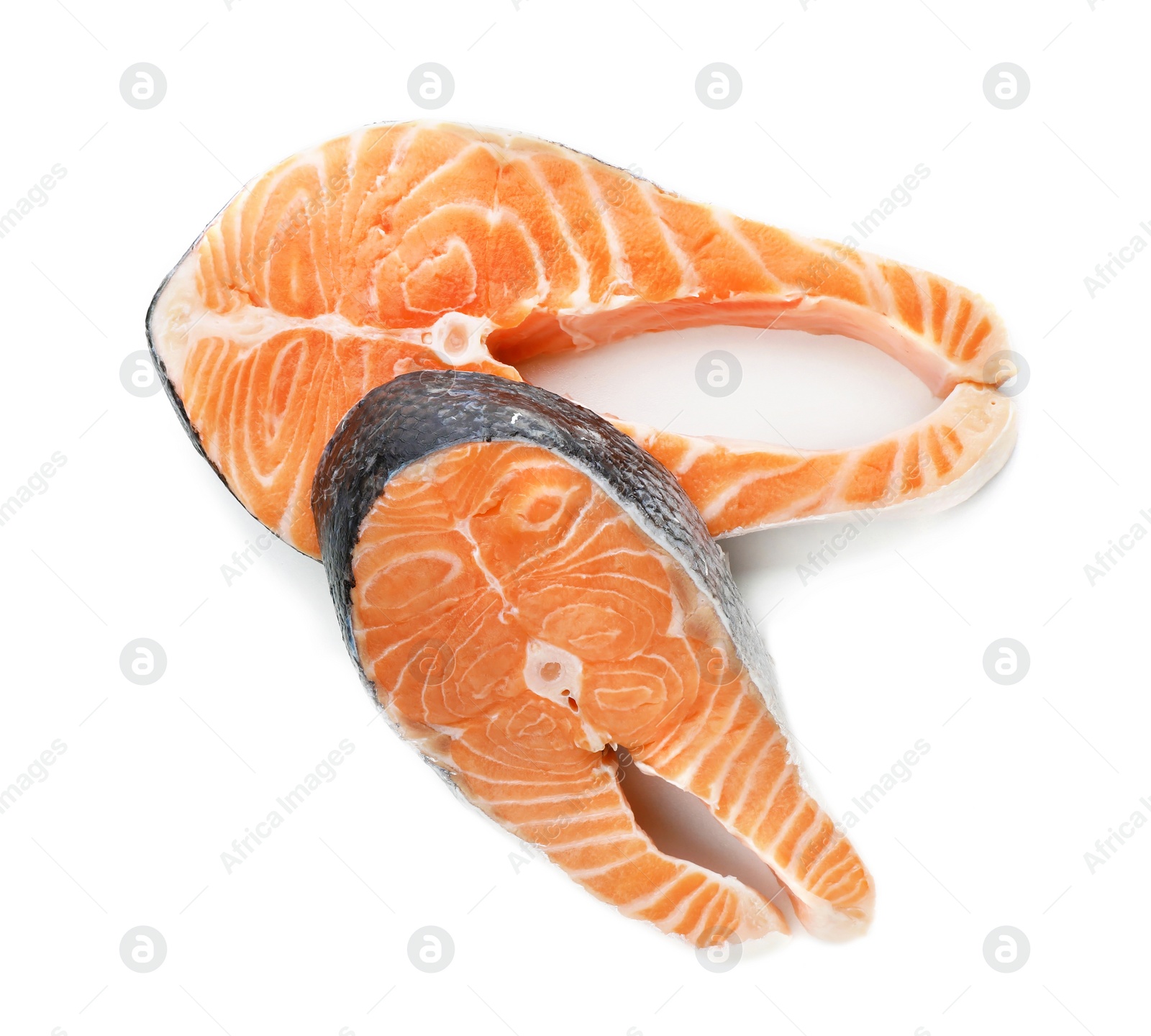 Photo of Fresh salmon steaks on white background, top view