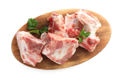Photo of Raw meaty bone and parsley on white background, top view