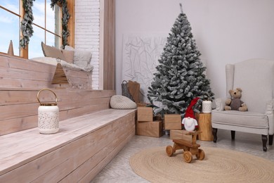 Stylish room interior with Christmas tree and festive decor