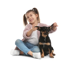 Photo of Little girl with cute puppy on white background
