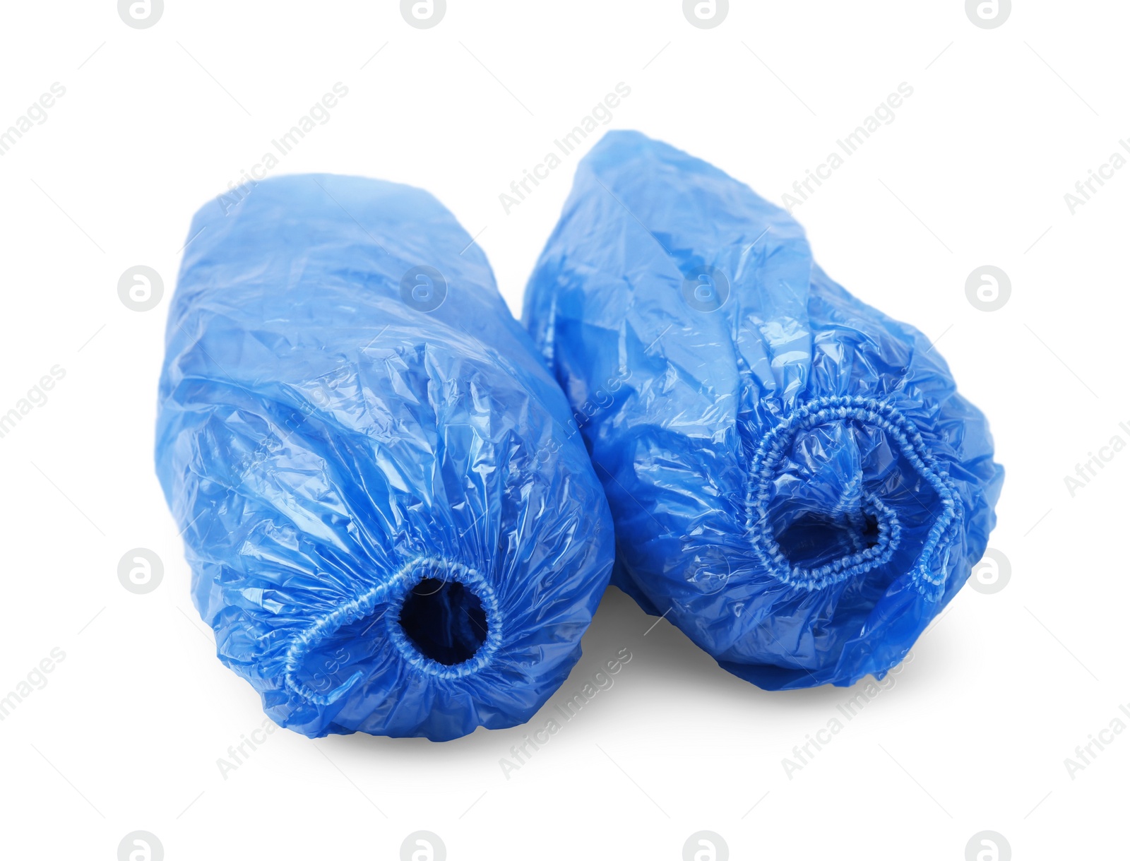 Photo of Rolled blue shoe covers isolated on white