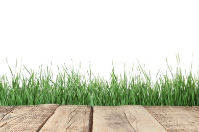 Photo of Wooden deck and green grass isolated on white