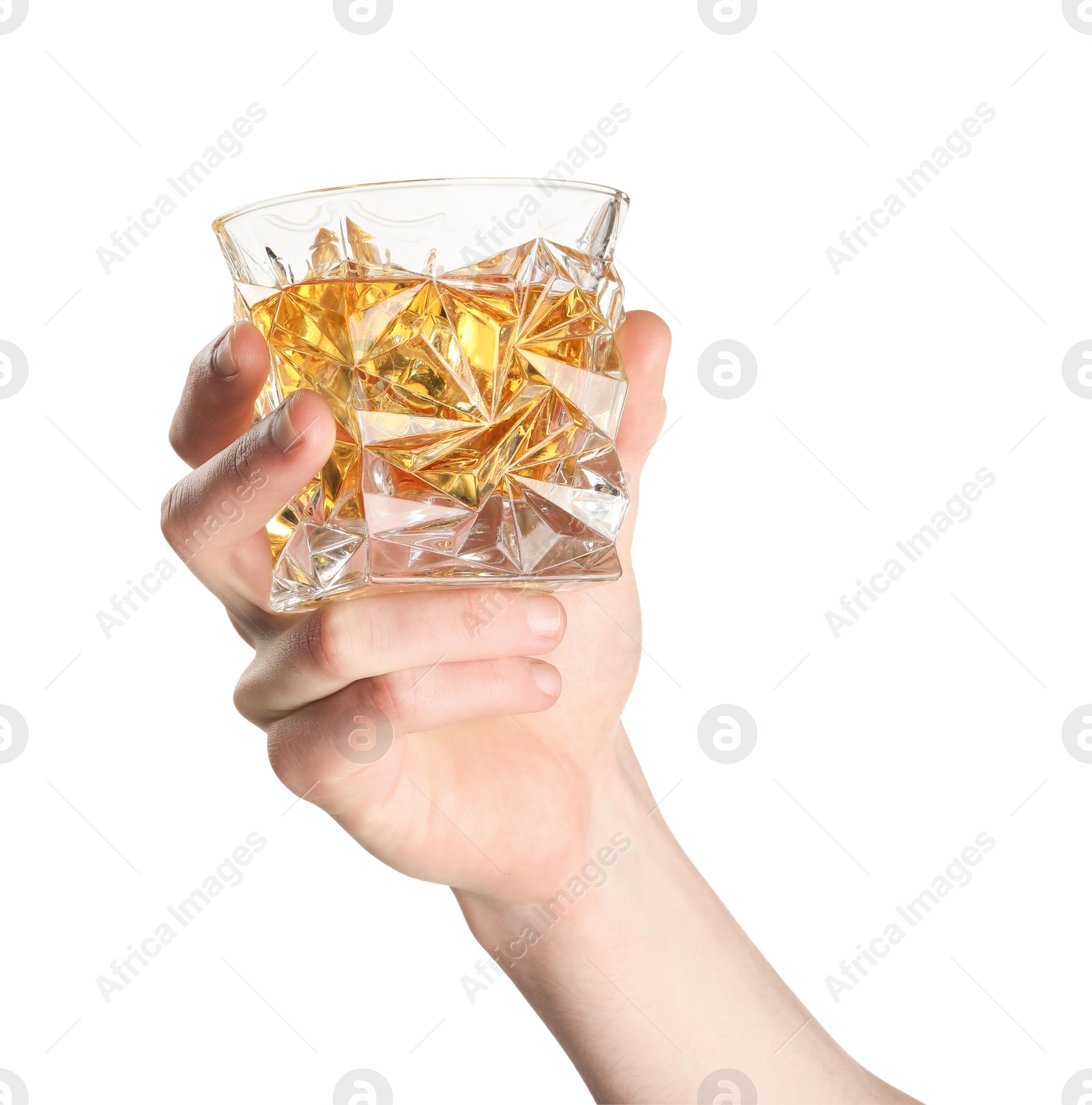 Photo of Man holding glass of whiskey with ice cubes on white background, closeup