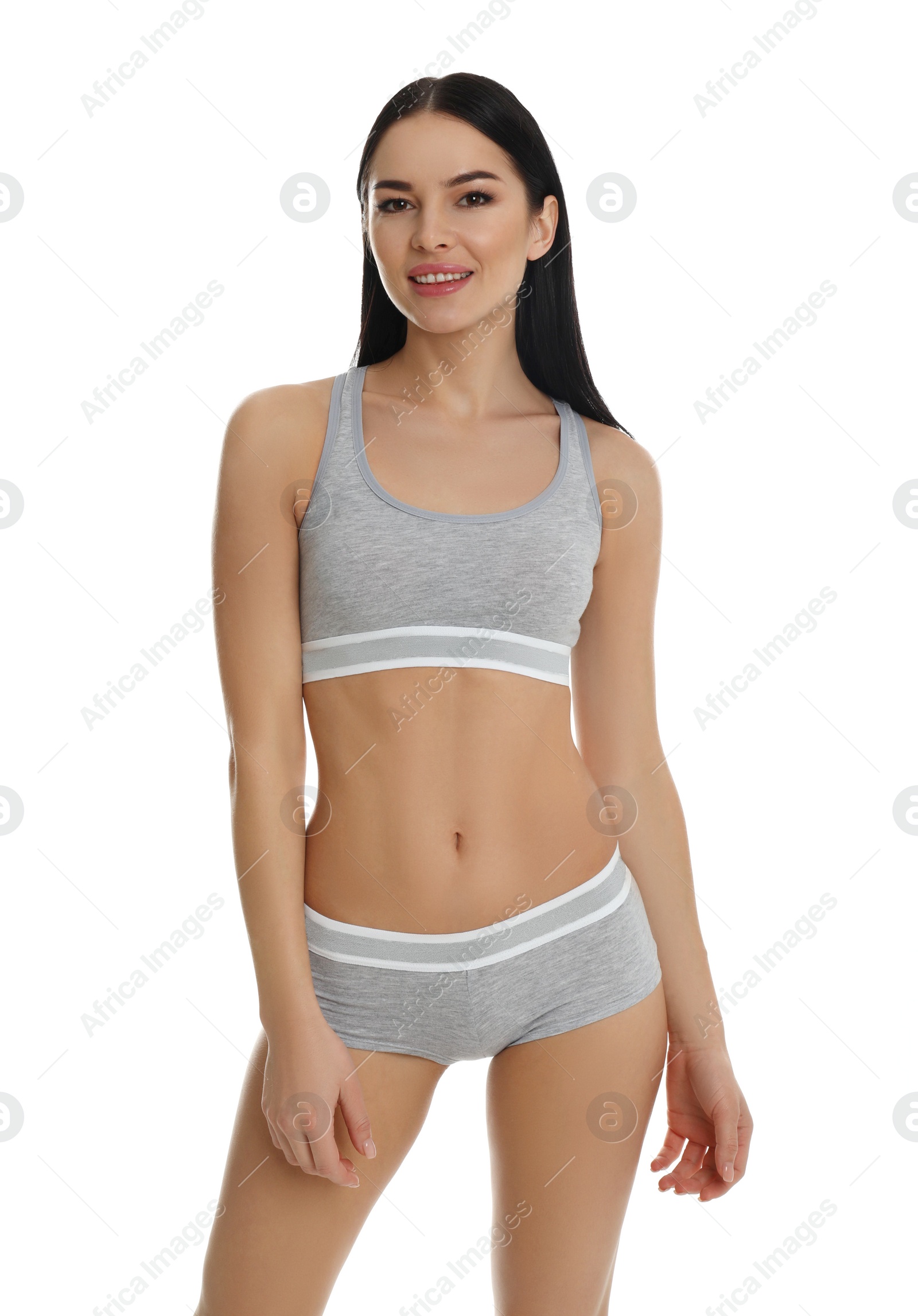 Photo of Beautiful young woman in grey sportive underwear isolated on white