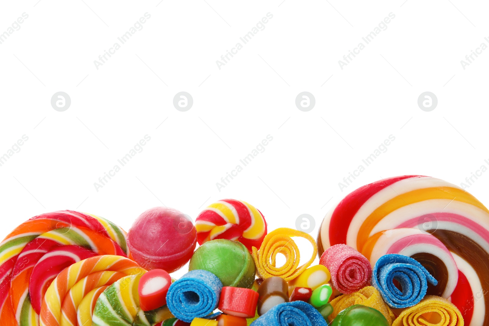 Photo of Many different yummy candies on white background. Space for text