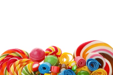 Photo of Many different yummy candies on white background. Space for text