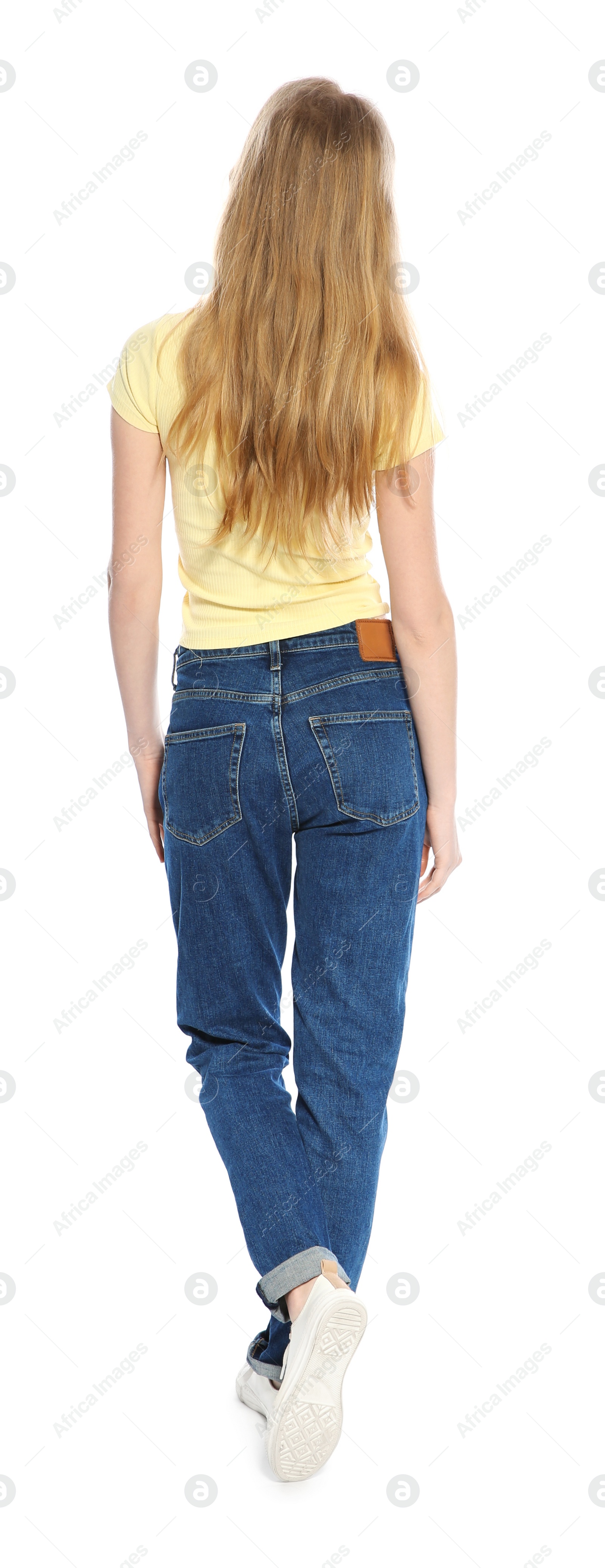 Photo of Young long haired woman posing on white background