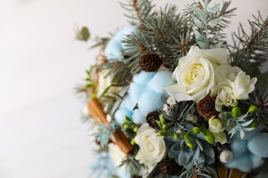 Photo of Beautiful wedding winter bouquet on light background, closeup. Space for text