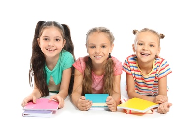 Group of little children with school supplies on white background