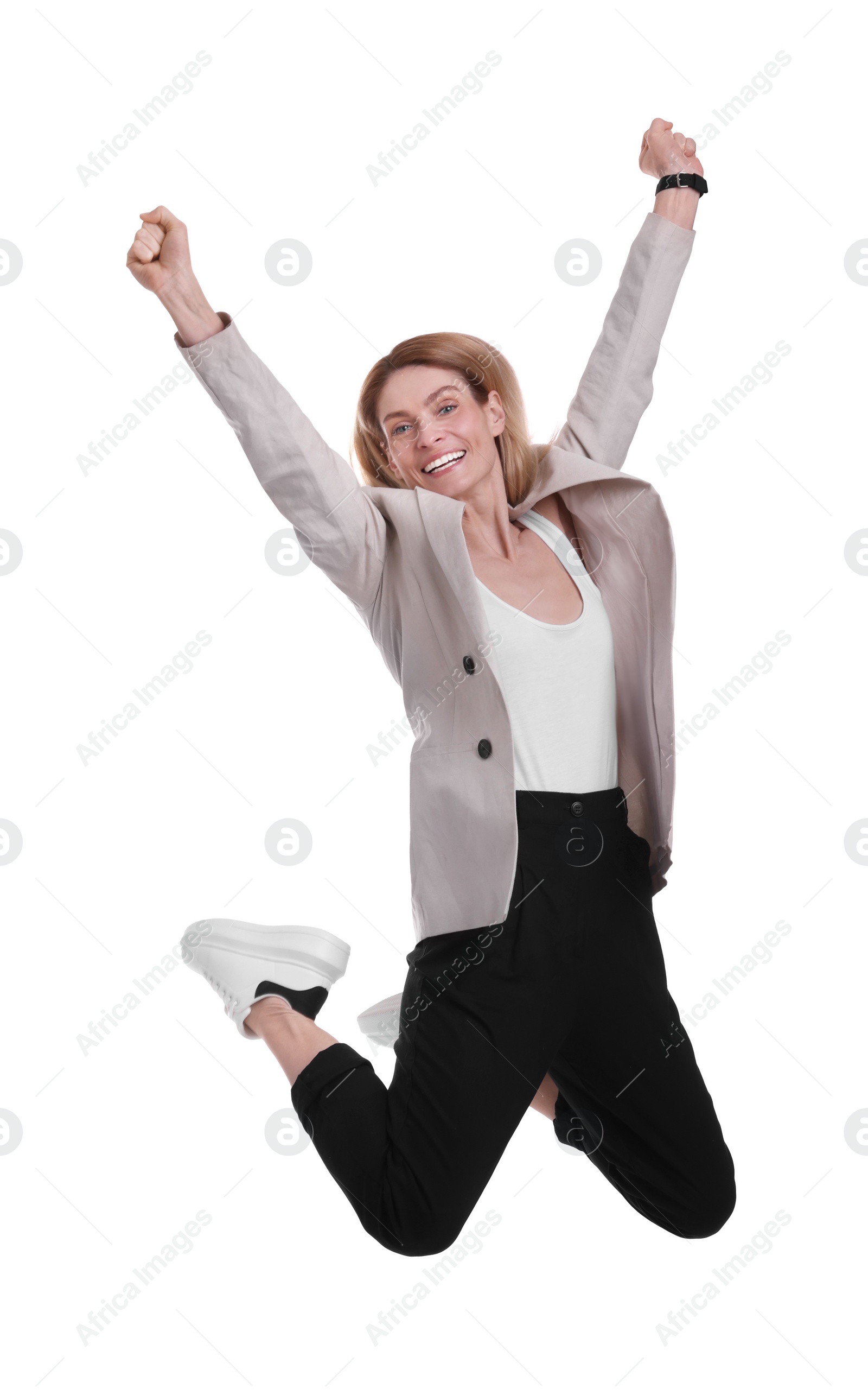 Photo of Beautiful happy businesswoman jumping on white background