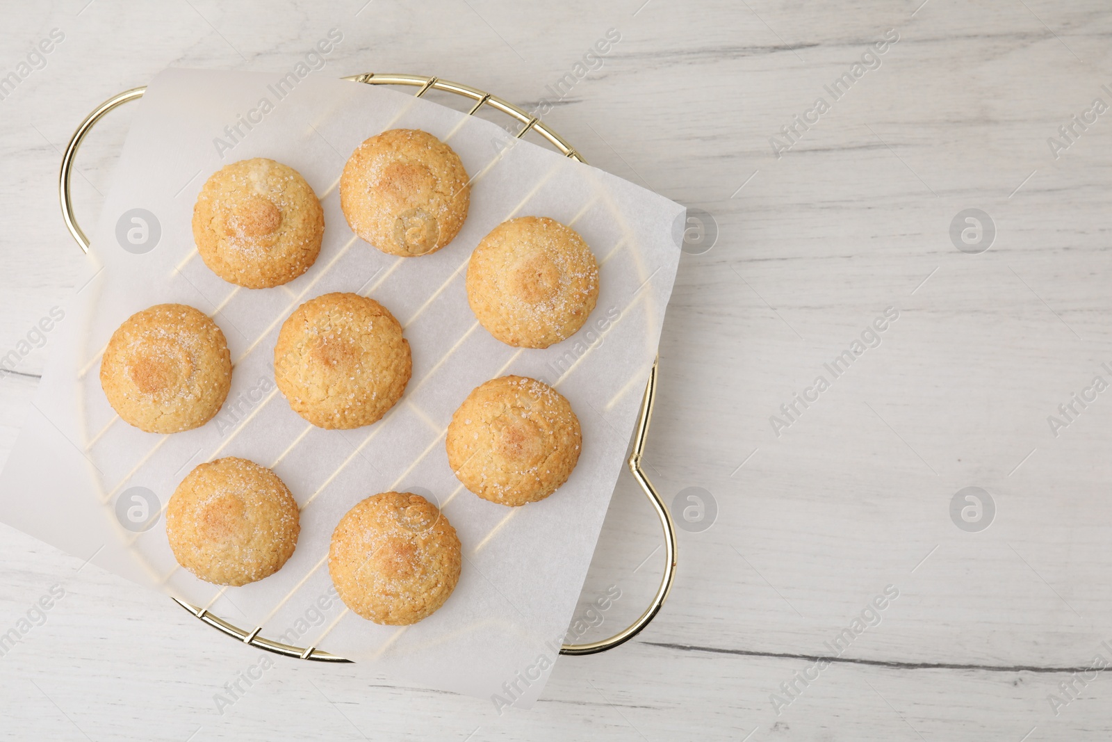 Photo of Tasty sweet sugar cookies on white wooden table, top view. Space for text