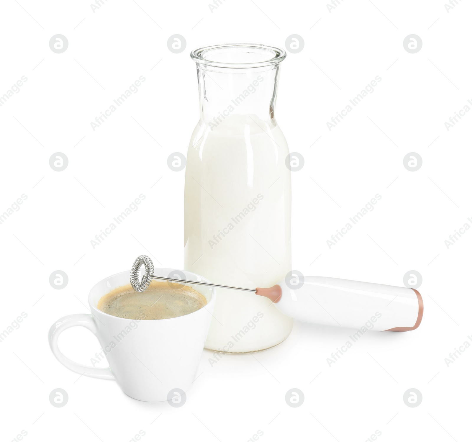 Photo of Mini mixer (milk frother), cup of coffee and bottle isolated on white