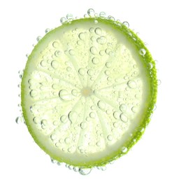 Fresh lime slice in sparkling water on white background