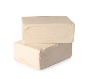 Photo of Blocks of compressed yeast on white background