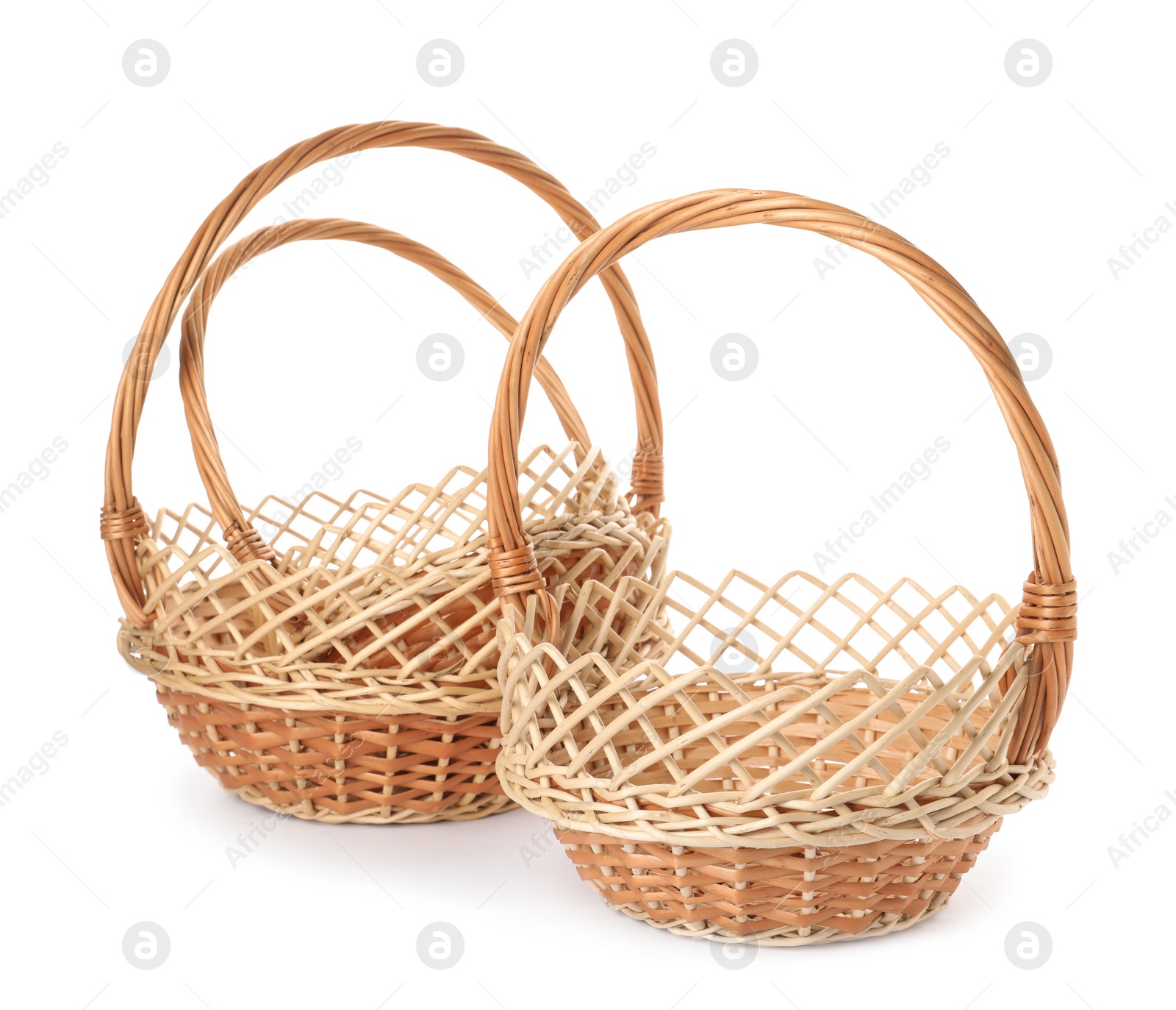 Photo of Three decorative wicker baskets on white background