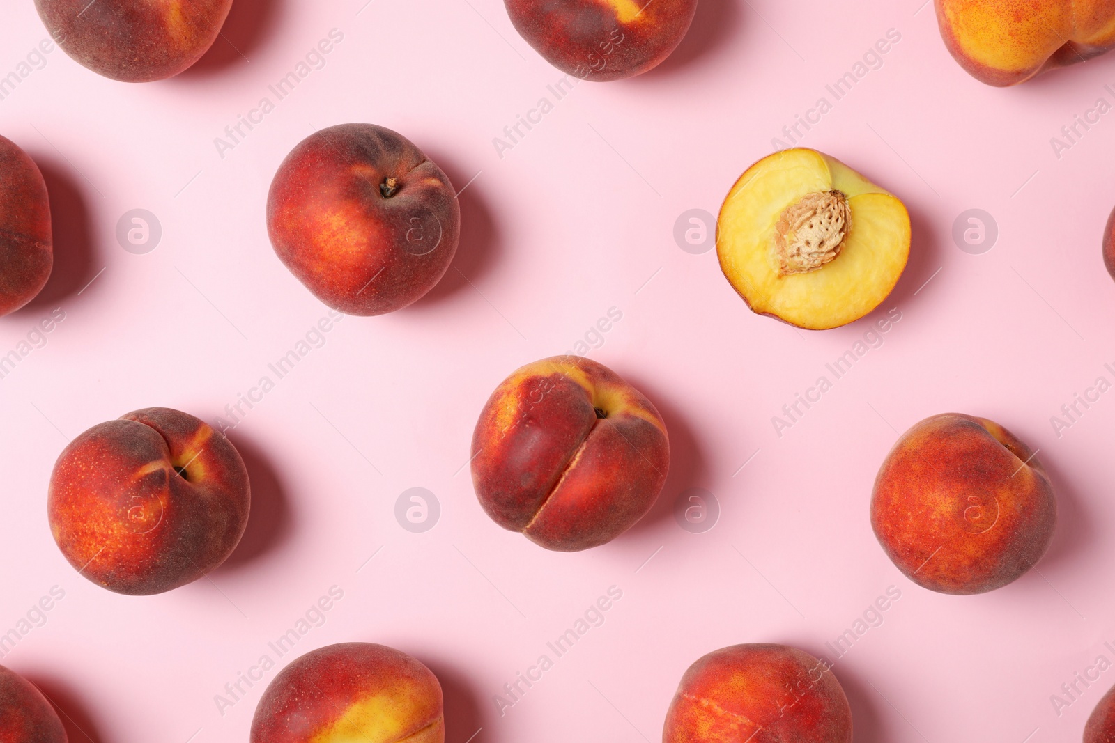 Photo of Flat lay composition with sweet juicy peaches on pink background