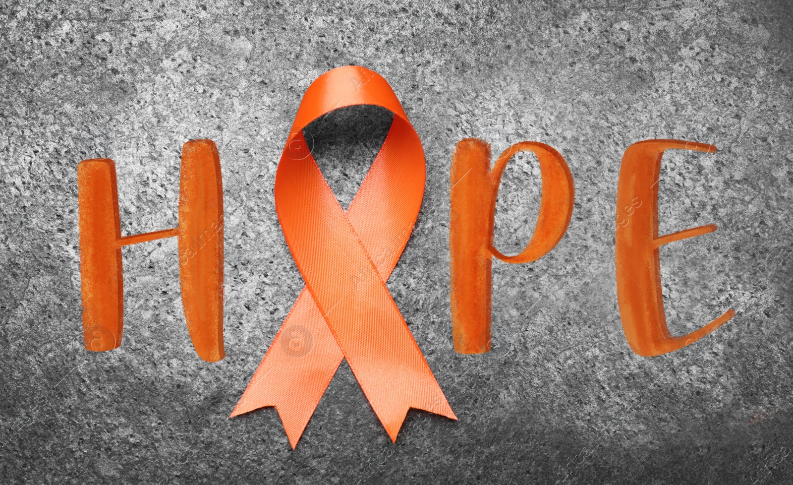 Image of Orange ribbon and word HOPE on grey background, top view 