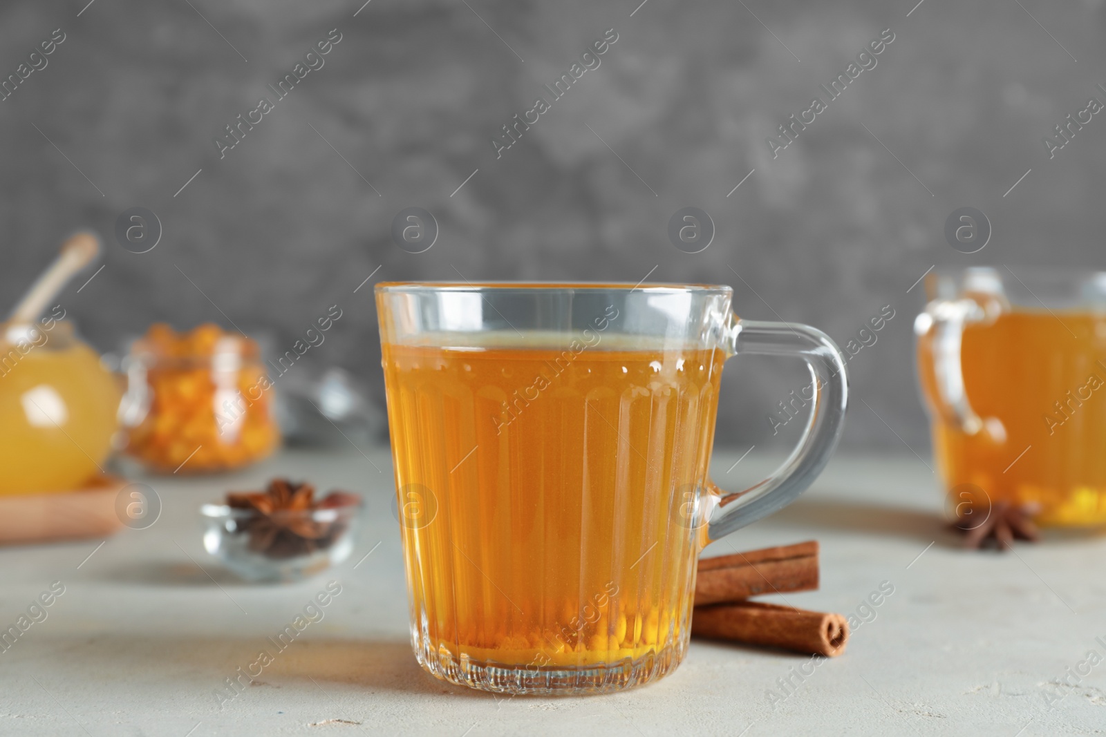 Photo of Glass cup of immunity boosting tea on light table