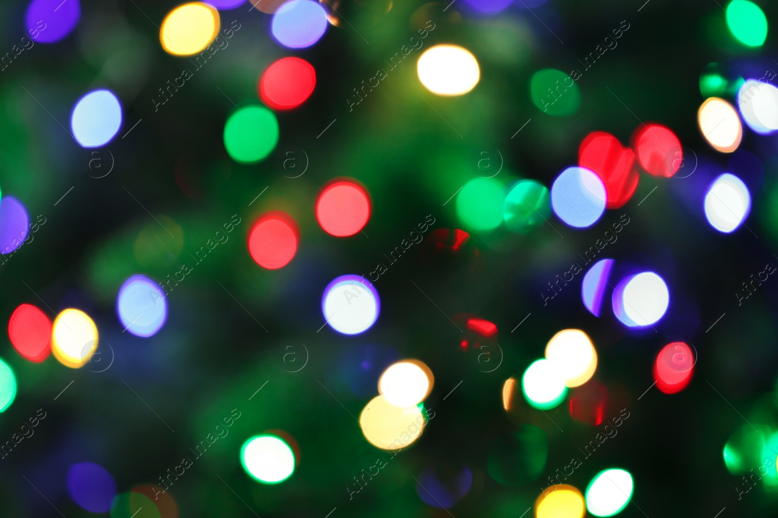 Photo of Abstract background with blurred colorful Christmas lights, bokeh effect