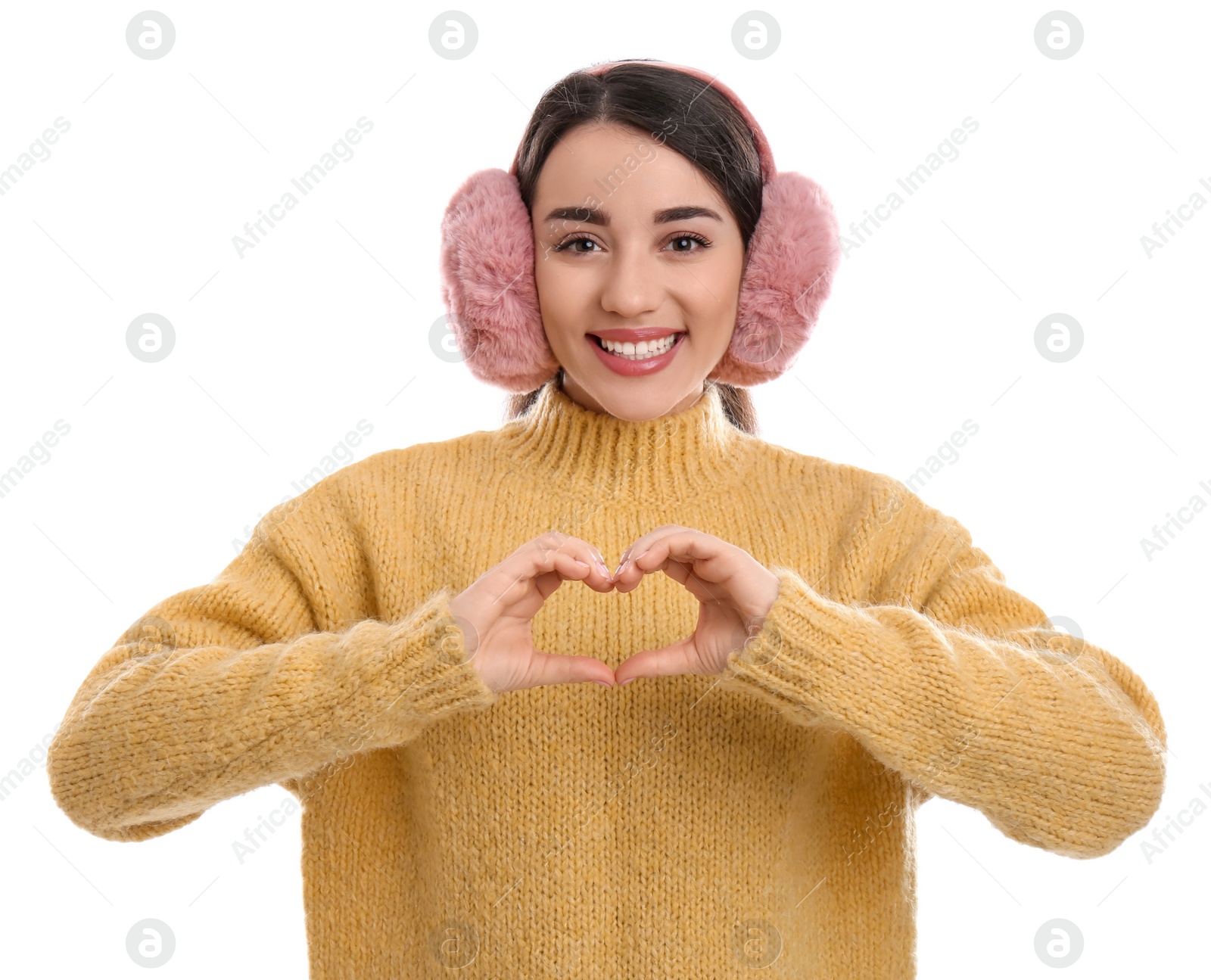 Photo of Beautiful young woman wearing earmuffs on white background