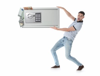 Image of Multiplying wealth, increasing savings. Excited man holding steel safe full of money on white background
