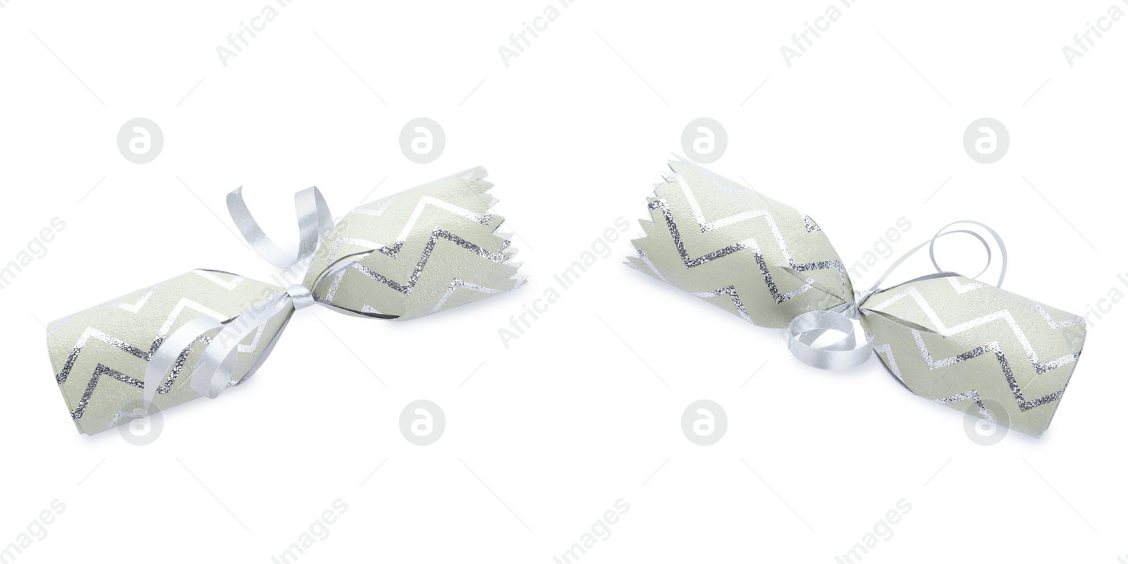 Photo of Open Christmas cracker isolated on white. Festive decoration