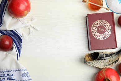 Photo of Flat lay composition with Rosh Hashanah holiday symbols on white wooden table. Space for text