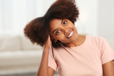 Photo of Portrait of smiling African American woman at home