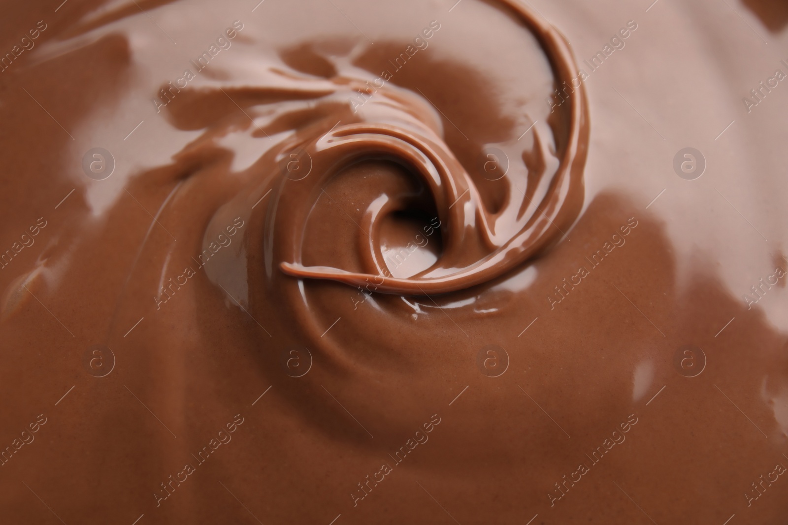 Photo of Sweet tasty chocolate cream as background, closeup