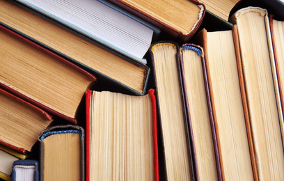 Photo of Many different hardcover books as background, top view