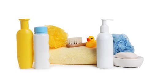 Baby cosmetic products, bath duck, brush and towel isolated on white