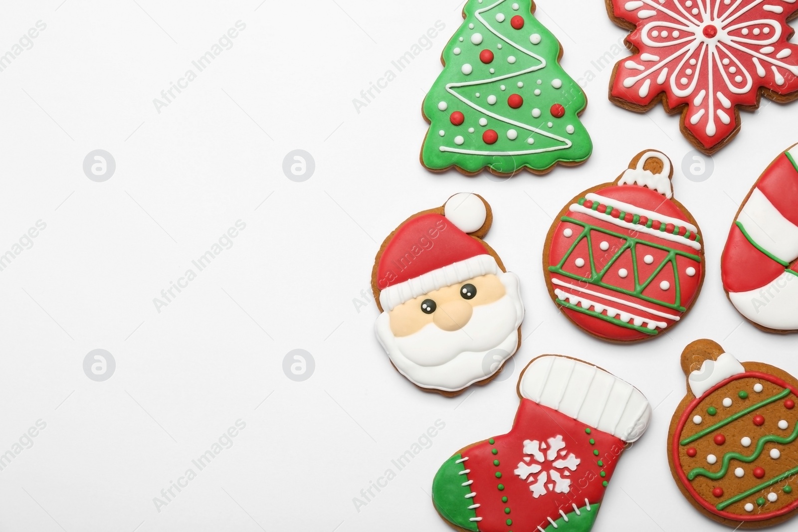 Photo of Different tasty Christmas cookies on white background, flat lay. Space for text