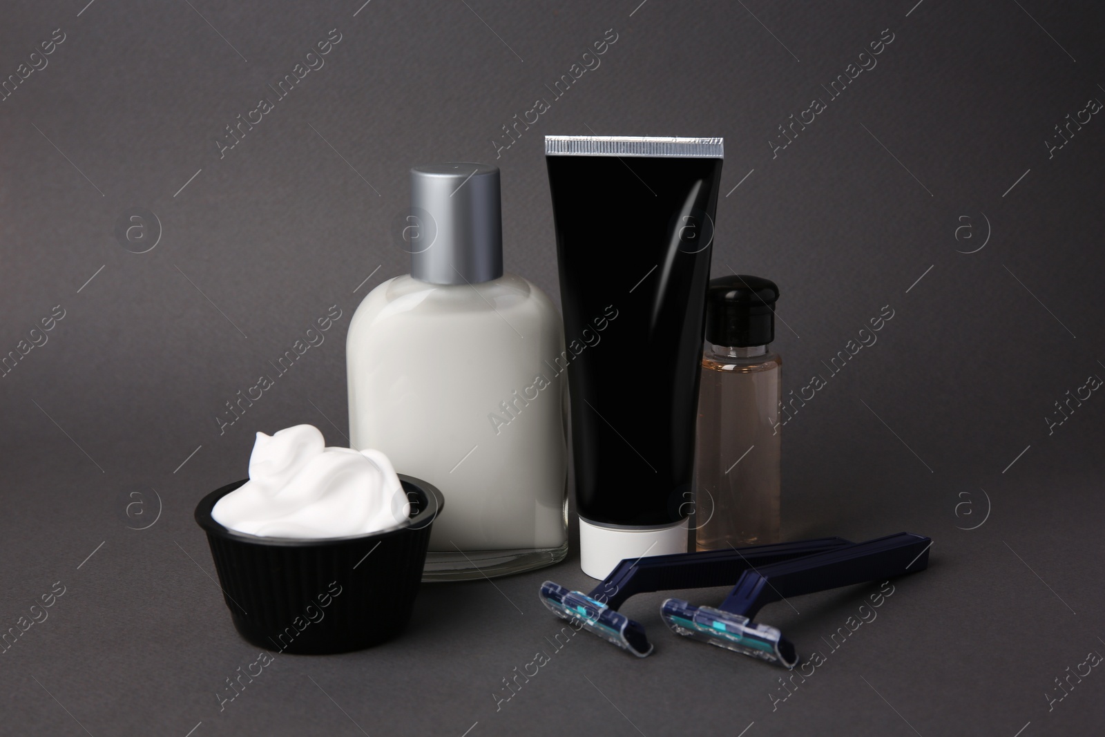 Photo of Different men's shaving accessories on grey background