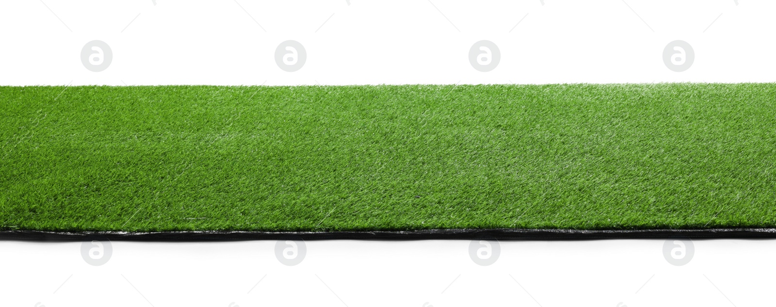 Photo of Green artificial grass surface isolated on white