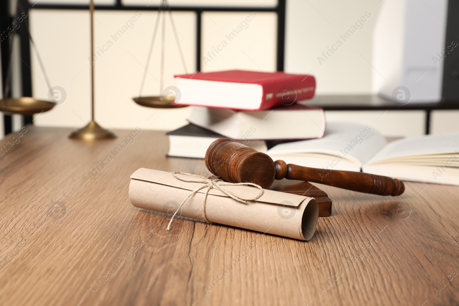 Photo of Document and gavel on wooden table. Notary contract