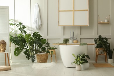 Stylish bathroom interior with green plants. Home design