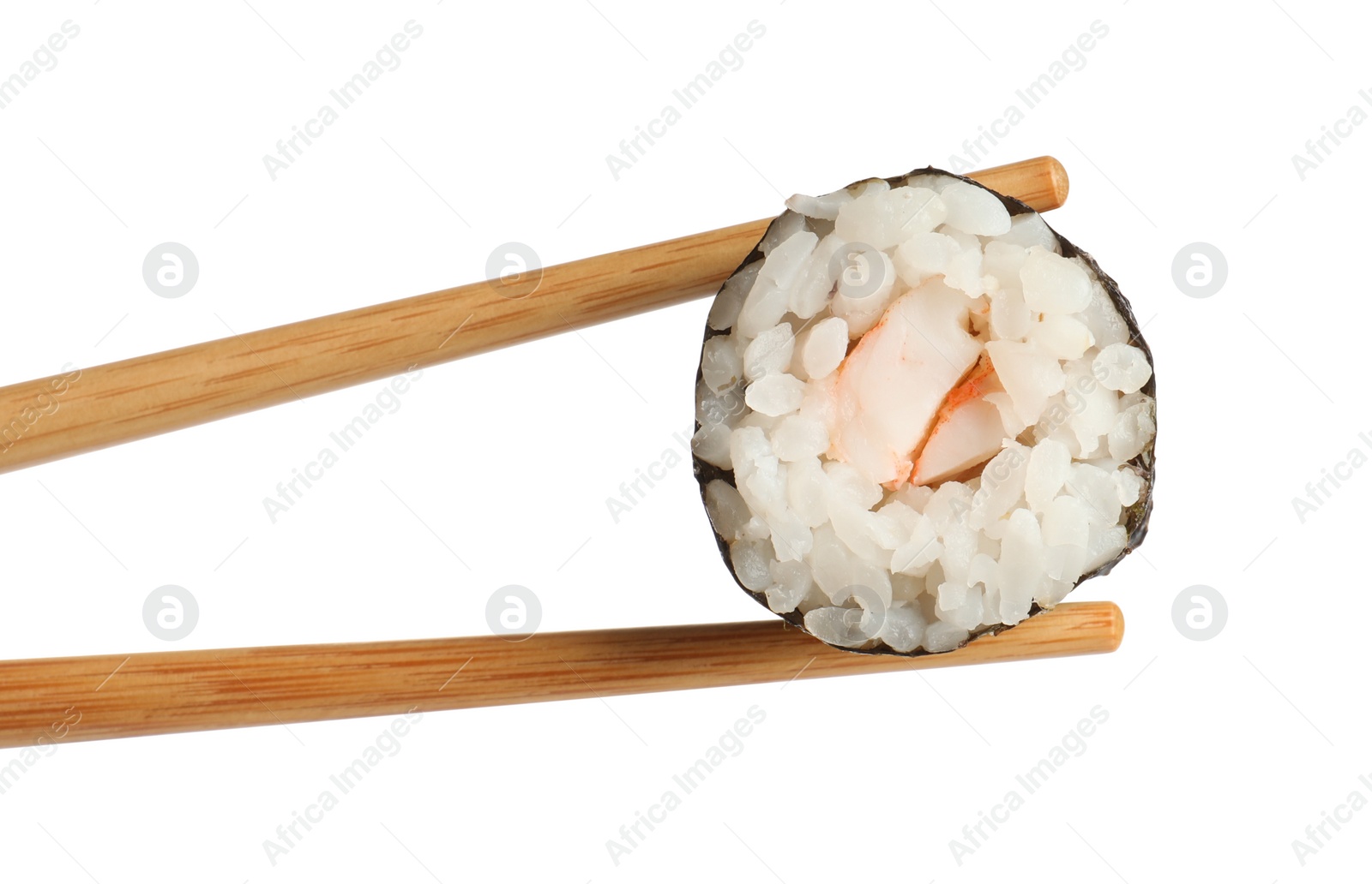 Photo of Chopsticks with tasty fresh sushi roll isolated on white